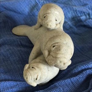 Manatee figure.